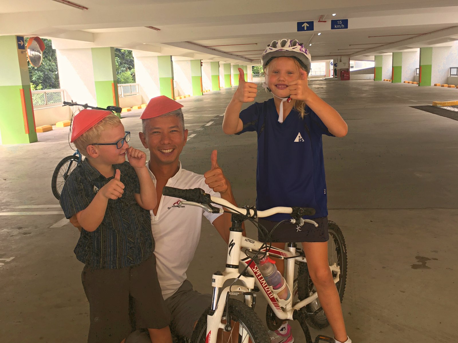 Coach Fai with students after cycling lesson Singapore